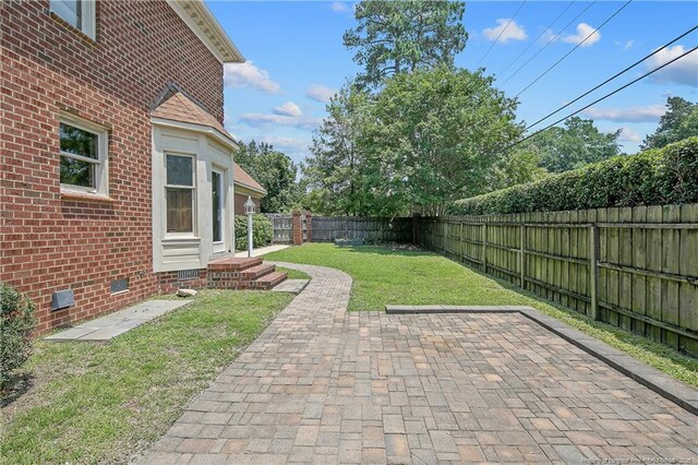 223 Devane St, Fayetteville, NC 28305 - fenced backyard featuring a patio