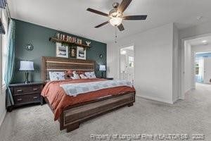 360 Carolina Church Rd, Saint Paul, NC 28384 - carpeted bedroom with baseboards and ceiling fan