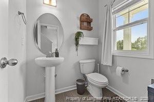 360 Carolina Church Rd, Saint Paul, NC 28384 - bathroom with toilet and baseboards