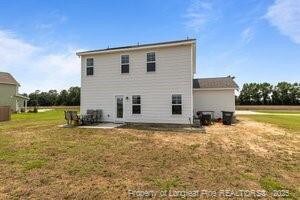 360 Carolina Church Rd, Saint Paul, NC 28384 - back of house with a yard