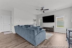 360 Carolina Church Rd, Saint Paul, NC 28384 - living area with wood finished floors and ceiling fan
