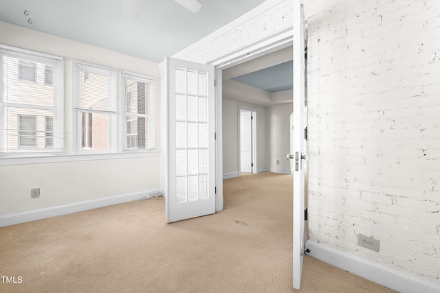 235 Mccauley St Unit # D, Chapel Hill, NC 27516 - empty room with light carpet and a ceiling fan