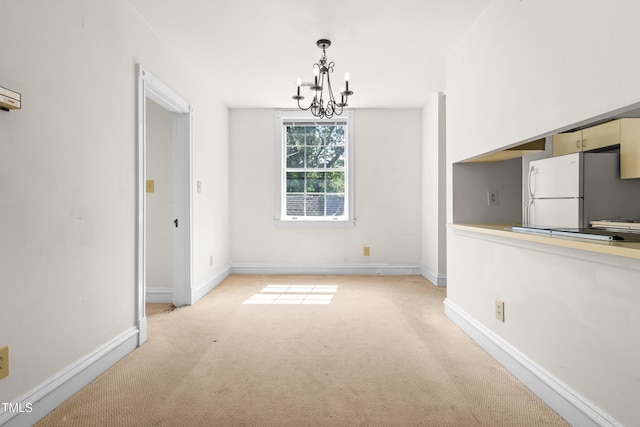 235 Mccauley St Unit # D, Chapel Hill, NC 27516 - unfurnished dining area featuring a chandelier and light carpet