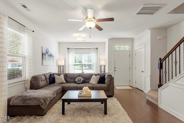 7879 Allscott Way, Raleigh, NC 27612 - living room with wood finished floors, stairway, and ceiling fan