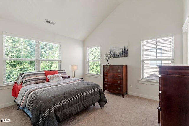 7879 Allscott Way, Raleigh, NC 27612 - bedroom with high vaulted ceiling, multiple windows, and light colored carpet