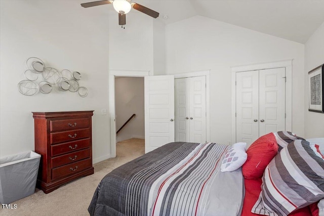 7879 Allscott Way, Raleigh, NC 27612 - bedroom featuring light carpet, high vaulted ceiling, multiple closets, and a ceiling fan