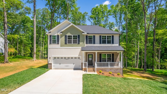 3013 Wesley Farm Ln, Sophia, NC 27350 - view of front of home featuring covered porch, concrete driveway, an attached garage, and a front yard