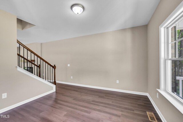 3013 Wesley Farm Ln, Sophia, NC 27350 - spare room with dark wood-style flooring and stairway