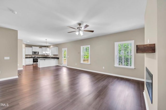 3013 Wesley Farm Ln, Sophia, NC 27350 - unfurnished living room with healthy amount of natural light, ceiling fan, dark wood-type flooring, and recessed lighting