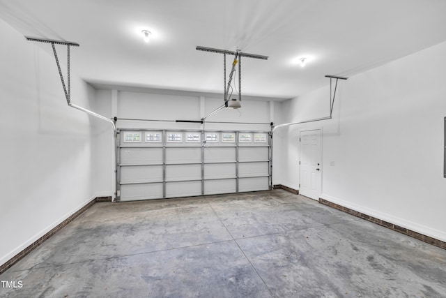 3013 Wesley Farm Ln, Sophia, NC 27350 - garage featuring baseboards and a garage door opener