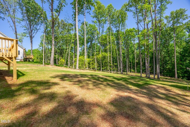 3013 Wesley Farm Ln, Sophia, NC 27350 - view of green lawn with a wooden deck