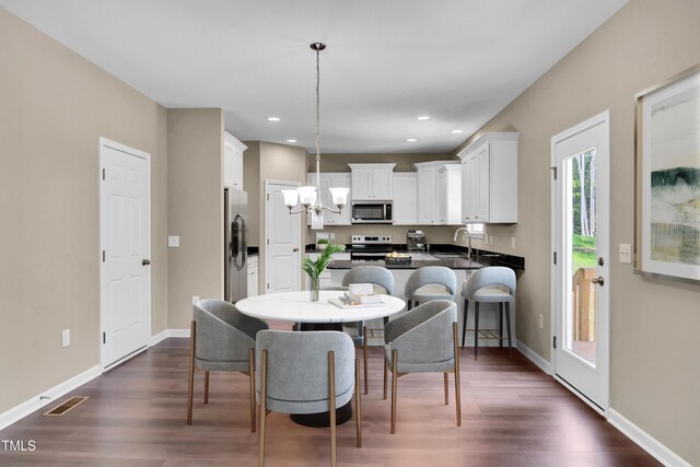 3013 Wesley Farm Ln, Sophia, NC 27350 - dining room with dark wood-style flooring, recessed lighting, and a chandelier
