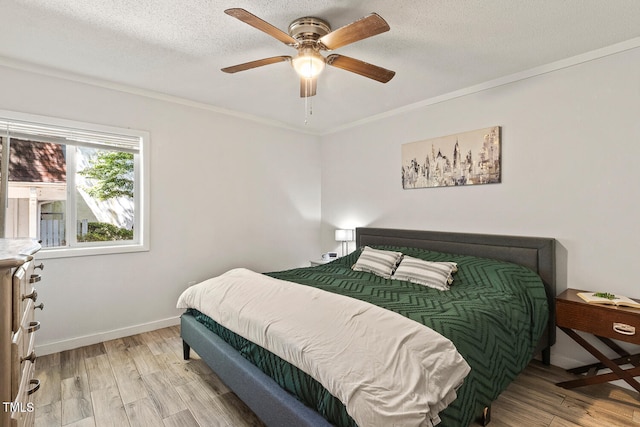 7002 Longstreet Dr Unit C, Raleigh, NC 27615 - bedroom with light wood-style flooring, crown molding, a textured ceiling, and ceiling fan