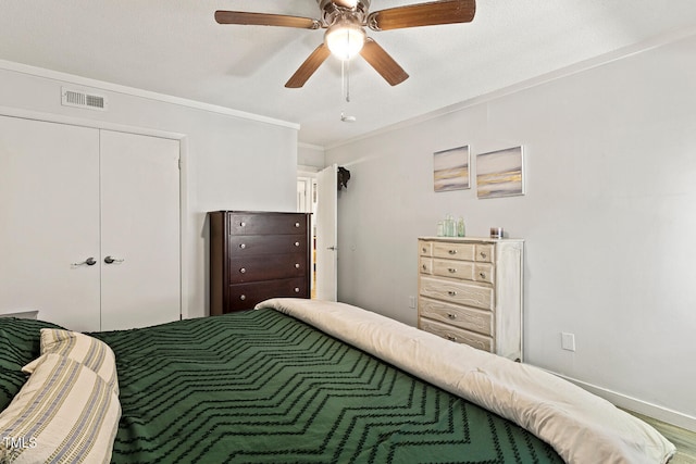 7002 Longstreet Dr Unit C, Raleigh, NC 27615 - bedroom with a closet, a ceiling fan, and ornamental molding