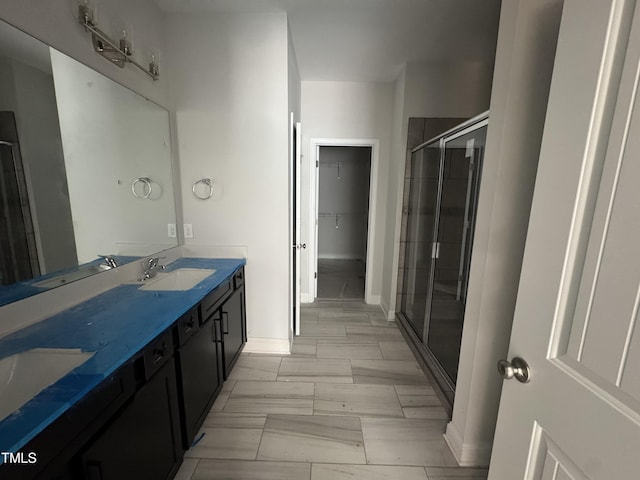 5428 Jaeger Dr Lot # 45, Graham, NC 27253 - full bath with double vanity, a shower stall, and a walk in closet