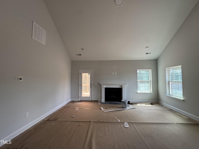5428 Jaeger Dr Lot # 45, Graham, NC 27253 - unfurnished living room with a fireplace and high vaulted ceiling