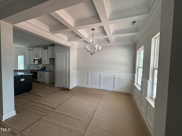 5428 Jaeger Dr Lot # 45, Graham, NC 27253 - unfurnished dining area with a chandelier, beamed ceiling, coffered ceiling, a decorative wall, and crown molding