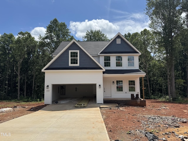 5428 Jaeger Dr Lot # 45, Graham, NC 27253 - view of front of house with covered porch, concrete driveway, and a garage