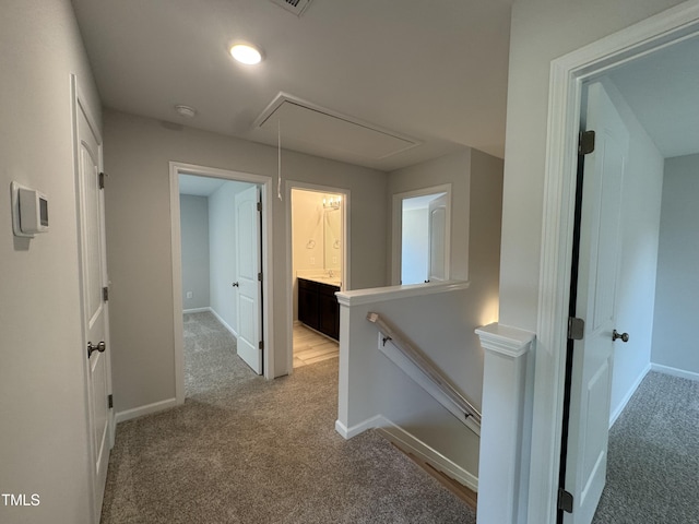 5428 Jaeger Dr Lot # 45, Graham, NC 27253 - corridor featuring attic access, light carpet, and an upstairs landing