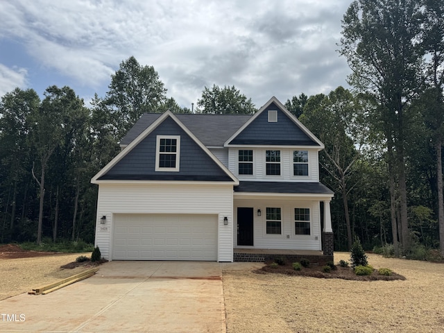5428 Jaeger Dr Lot # 45, Graham, NC 27253 - view of front of property featuring driveway, a porch, and an attached garage