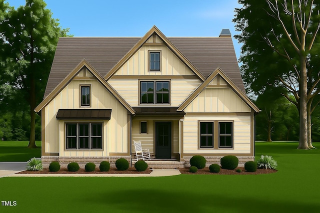 5545 Silk Hope Gum Springs Rd, Siler City, NC 27344 - view of front facade with board and batten siding, a front yard, a standing seam roof, and a metal roof