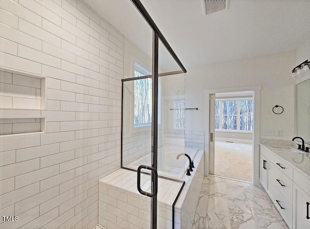 5545 Silk Hope Gum Springs Rd, Siler City, NC 27344 - full bath with a stall shower, marble look tiles, vanity, and plenty of natural light