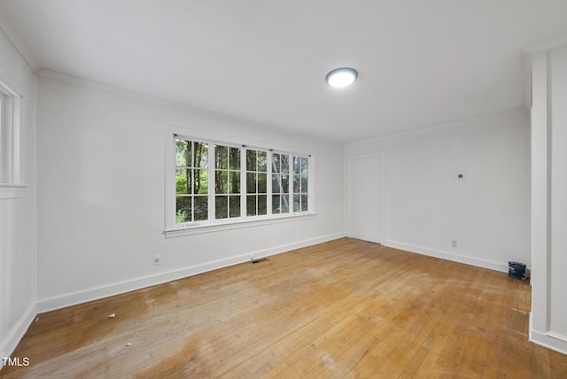 1219 Carlton Ave, Raleigh, NC 27606 - spare room with hardwood / wood-style flooring and crown molding