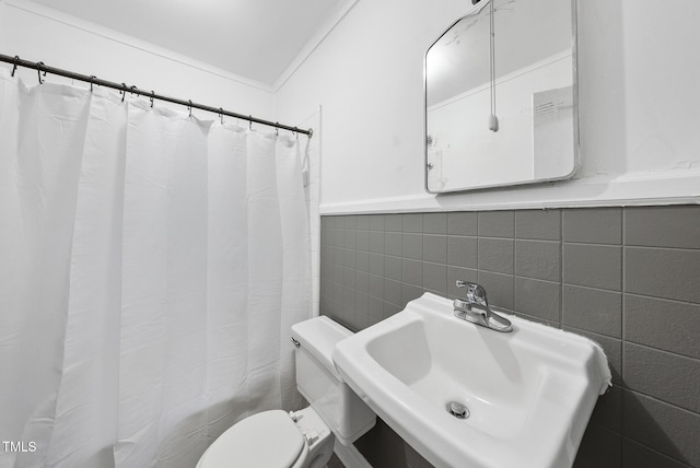 1219 Carlton Ave, Raleigh, NC 27606 - bathroom with tile walls, curtained shower, and a wainscoted wall