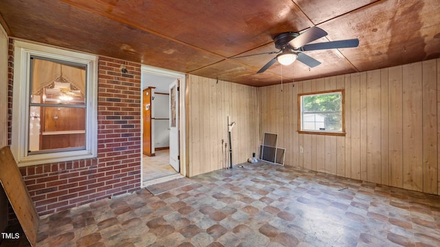 3701 Oak Grove Church Rd, Mebane, NC 27302 - spare room with stone finish floors, a ceiling fan, wooden walls, and wooden ceiling