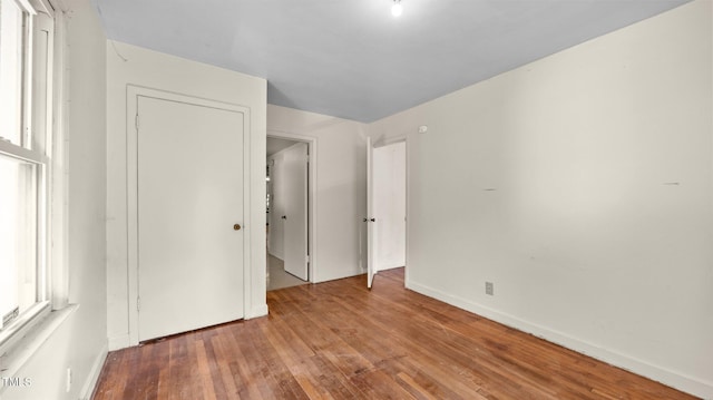 3701 Oak Grove Church Rd, Mebane, NC 27302 - unfurnished bedroom with wood finished floors and baseboards