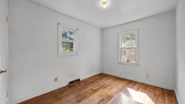 3701 Oak Grove Church Rd, Mebane, NC 27302 - spare room featuring plenty of natural light and hardwood / wood-style floors
