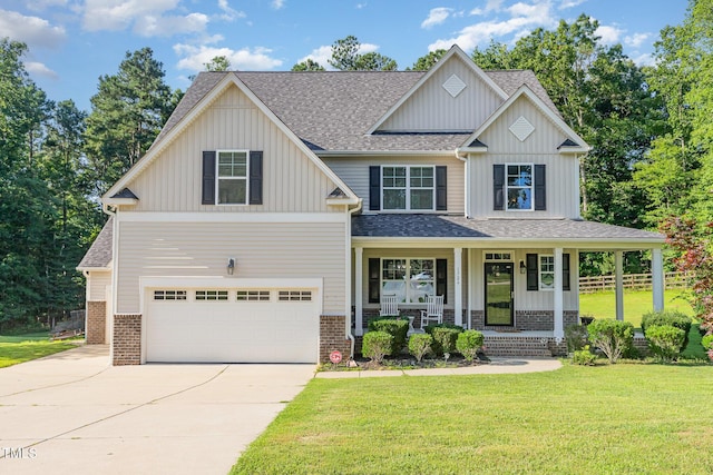 1726 Rapids Ct, Franklinton, NC 27525 - craftsman-style home featuring a garage, covered porch, concrete driveway, board and batten siding, and a front lawn