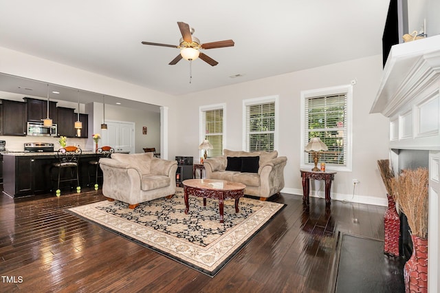 1726 Rapids Ct, Franklinton, NC 27525 - living area with ceiling fan and dark wood-style floors