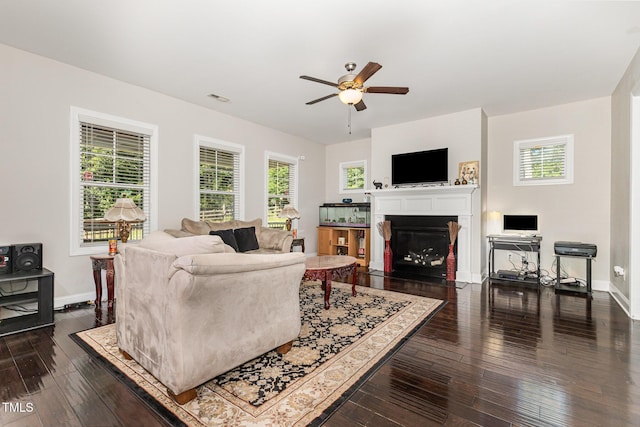 1726 Rapids Ct, Franklinton, NC 27525 - living room with a ceiling fan, a fireplace with flush hearth, plenty of natural light, and dark wood-type flooring
