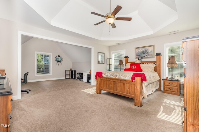 1726 Rapids Ct, Franklinton, NC 27525 - bedroom with a raised ceiling, light carpet, multiple windows, a ceiling fan, and lofted ceiling
