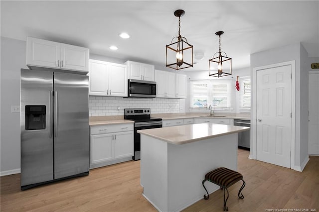 2240 Spindle Tree Dr, Fayetteville, NC 28304 - kitchen with stainless steel appliances, white cabinets, backsplash, and recessed lighting