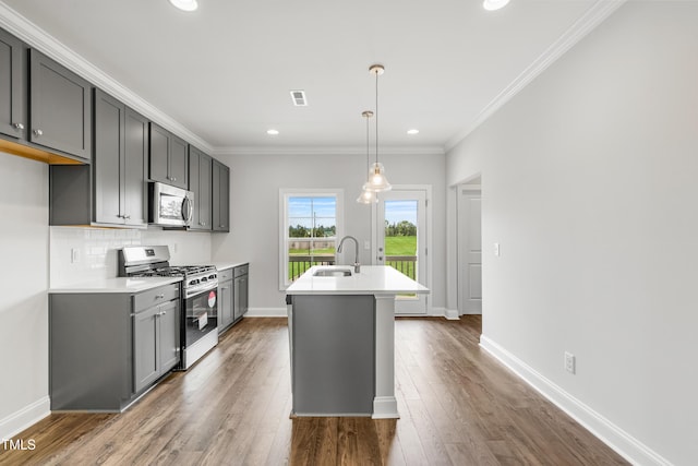 547 Forestville Rd, Wake Forest, NC 27587 - kitchen featuring stainless steel appliances, light countertops, a center island with sink, dark wood-type flooring, and recessed lighting