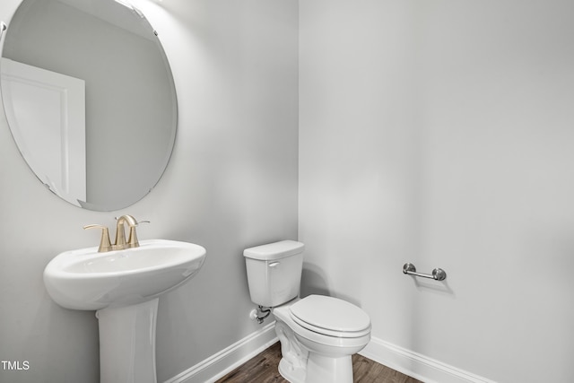 547 Forestville Rd, Wake Forest, NC 27587 - bathroom with baseboards and wood finished floors