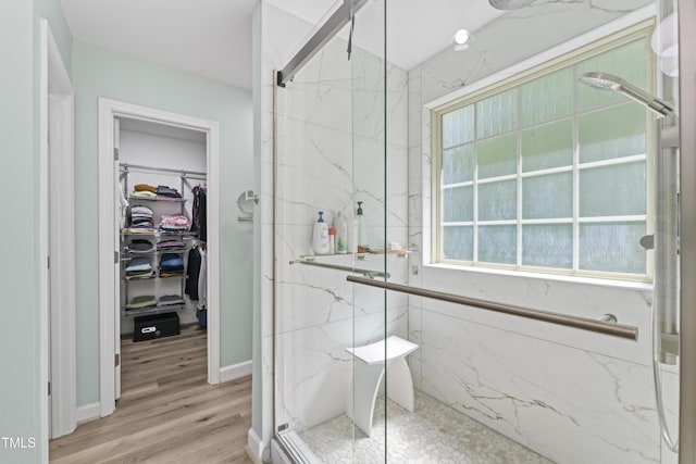 274 Marsh Creek Dr, Garner, NC 27529 - full bath featuring a marble finish shower, a spacious closet, and wood finished floors