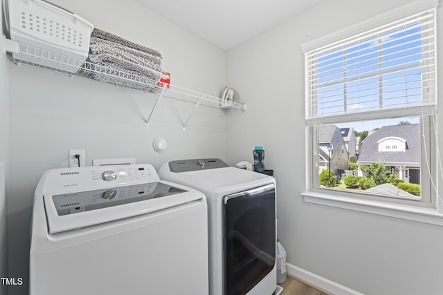 274 Marsh Creek Dr, Garner, NC 27529 - washroom featuring washer and dryer and wood finished floors