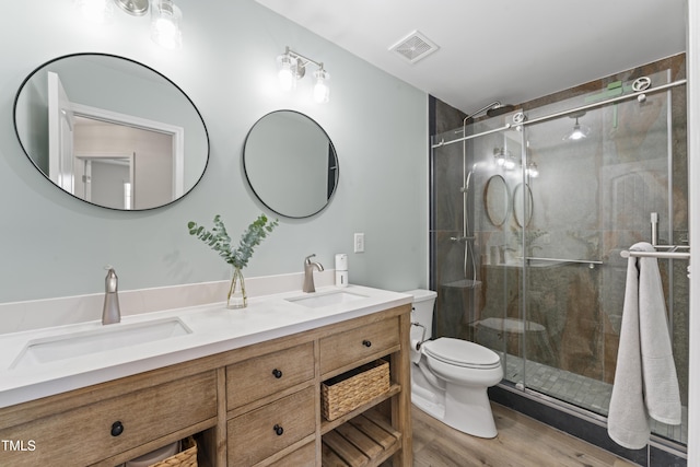 274 Marsh Creek Dr, Garner, NC 27529 - full bathroom featuring double vanity, a shower stall, and wood finished floors