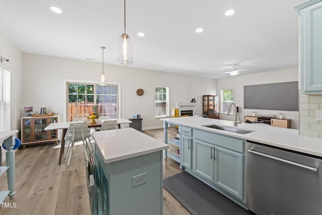 274 Marsh Creek Dr, Garner, NC 27529 - kitchen featuring stainless steel dishwasher, light countertops, pendant lighting, light wood finished floors, and recessed lighting