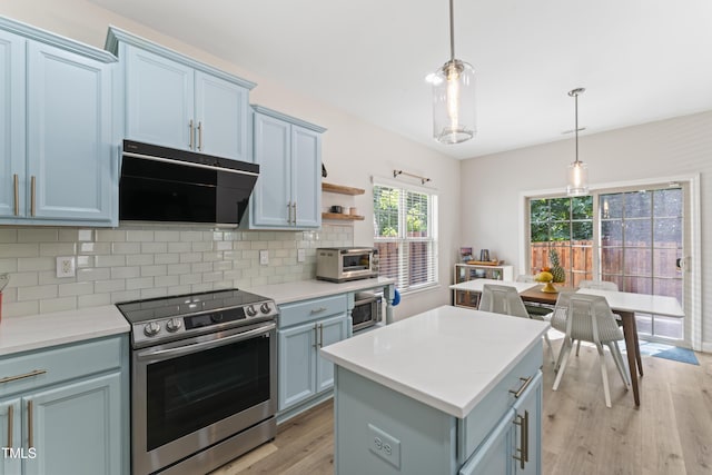 274 Marsh Creek Dr, Garner, NC 27529 - kitchen with stainless steel appliances, ventilation hood, light wood finished floors, tasteful backsplash, and light countertops