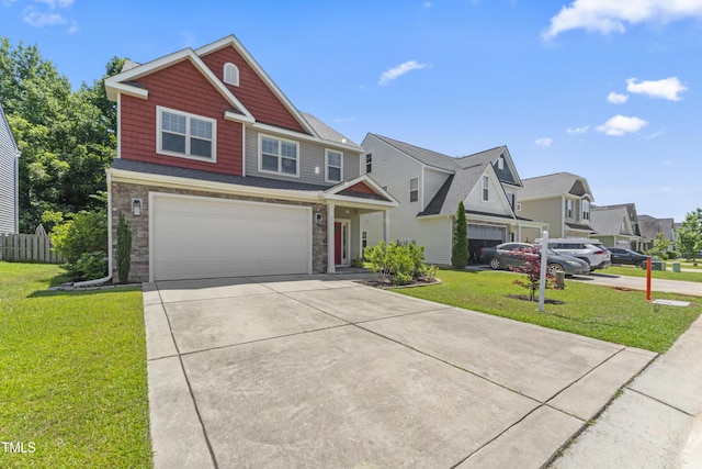 274 Marsh Creek Dr, Garner, NC 27529 - view of front of home featuring a garage, concrete driveway, a front yard, and stone siding