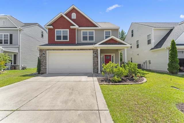 274 Marsh Creek Dr, Garner, NC 27529 - craftsman house with concrete driveway, a front lawn, a garage, and stone siding