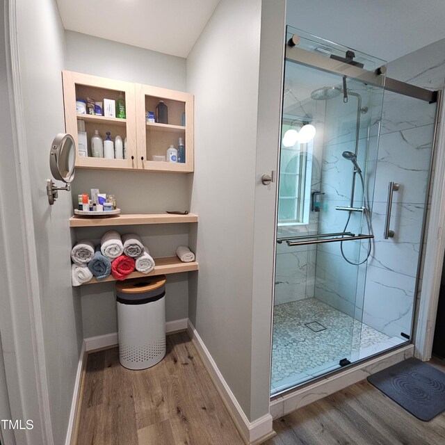 274 Marsh Creek Dr, Garner, NC 27529 - bathroom featuring wood finished floors and a marble finish shower
