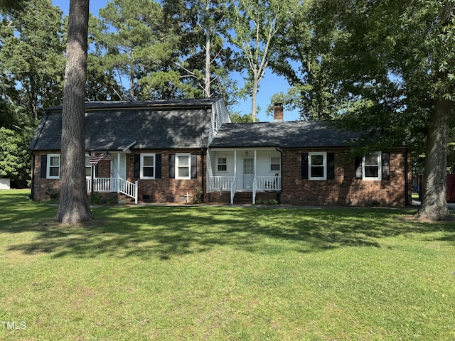 1604 Brunswick Dr, Dunn, NC 28334 - colonial inspired home featuring brick siding, a front yard, a chimney, and a porch
