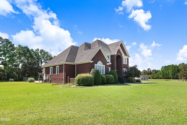 106 Woodmere Ln, Goldsboro, NC 27530 - view of home's exterior with brick siding and a yard