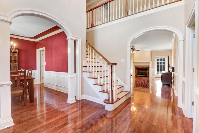 106 Woodmere Ln, Goldsboro, NC 27530 - foyer with a ceiling fan, hardwood / wood-style flooring, arched walkways, crown molding, and a fireplace