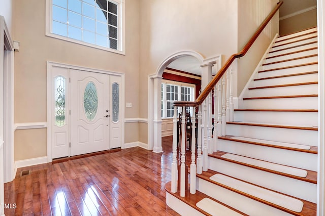 106 Woodmere Ln, Goldsboro, NC 27530 - entrance foyer with hardwood / wood-style floors, a high ceiling, stairs, and plenty of natural light